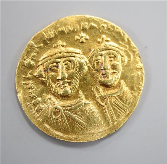 A Byzantine histamenon gold coin.